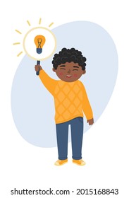 African ethnicity child holding light bulb. Kids' new idea. Children creative thinking concept.