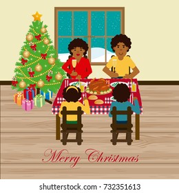 African family celebrating Christmas sitting around the table eating chicken