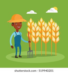 An african farmer in summer hat standing with pitchfork on the background of wheat field. Farmer holding agricultural tool and working in wheat field. Vector flat design illustration. Square layout.