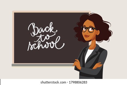 African Female Teacher Standing in Front of a Blackboard. Professor ready to start her lesson waiting in classroom 
