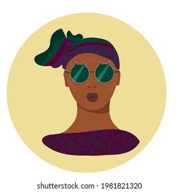 African girl with traditional clothes. Portrait. Black woman with green sunglasses