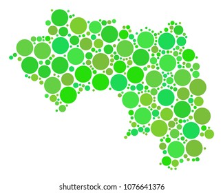 African Guinea Map collage of random filled circles in various sizes and green color tinges. Vector small spheres are grouped into african guinea map collage. Eco geographical map design concept.