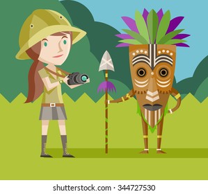 african hunter with mask and safari girl with camera