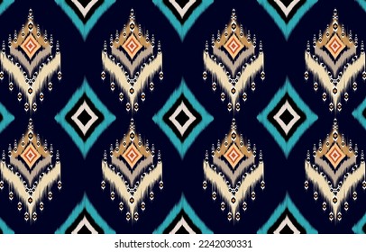 African Ikat paisley seamless pattern.
geometric ethnic oriental pattern traditional on blue background.
Aztec style abstract vector illustration.design for texture,fabric,
clothing,wrapping,carpet,