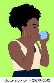 african lady with curly hairdo drinking coffee on green background