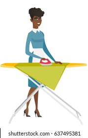 African maid ironing clothes using iron on ironing board after laundry. Full length of young hotel maid ironing clothes on ironing board. Vector flat design illustration isolated on white background.