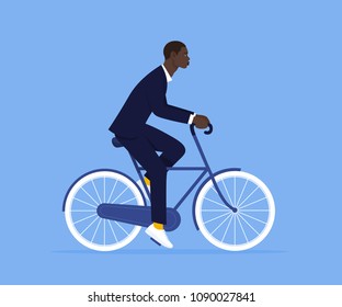 African man in a business suit. An office worker is riding a bicycle to work. Manager. Vector Flat Illustration