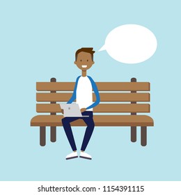 african man using laptop sitting wooden bench chat bubble character full length over blue background flat vector illustration