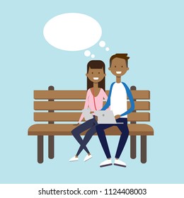 african man woman using laptop sitting wooden bench couple chat bubble character full length over blue background flat vector illustration