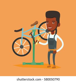 African Man Working In Bike Workshop. Technician Fixing Bicycle In Repair Shop. Bicycle Mechanic Repairing Bicycle. Man Installing Spare Part Bike. Vector Flat Design Illustration. Square Layout.