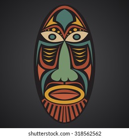 African mask on a black background