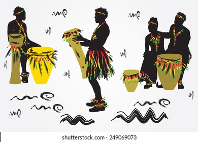 African Musicians dance and play the drums.