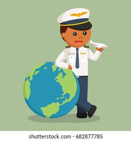 african pilot with big globe and plane toy