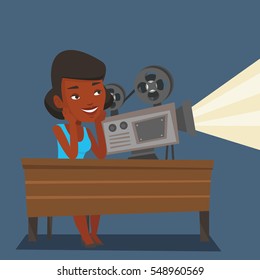 An african projectionist showing new film. Woman sitting at the table with film projector in the room of projectionist. Young projectionist at work. Vector flat design illustration. Square layout.