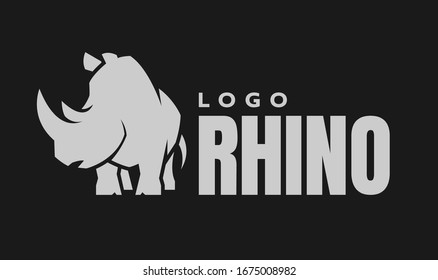 African rhino silhouette. Logo, symbol on a dark background.