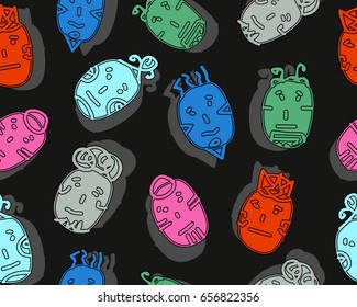 African ritual masks. Seamless pattern with faces. Vector illustration.