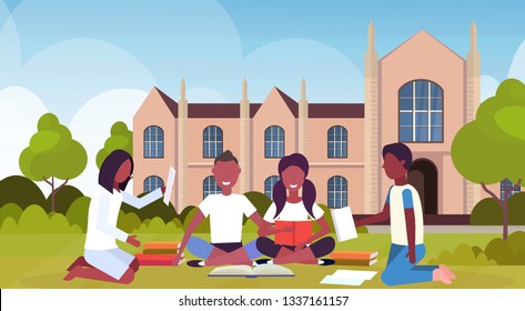 african students group sitting on grass at campus yard in front of modern national university building exterior people preparing exam graduation education concept flat horizontal