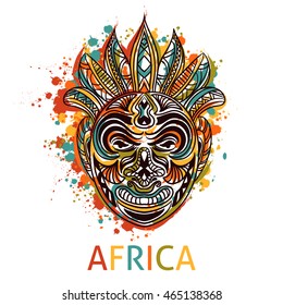 African tribal mask with ethnic geometric ornament and splashes in watercolor style. Hand drawn vector illustration