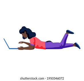 African woman freelancer, student at online learning works or studies at laptop lying on floor