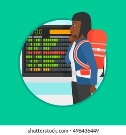 An african woman looking at departure board at the airport. Passenger standing at the airport in front of the departure board. Vector flat design illustration in the circle isolated on background.