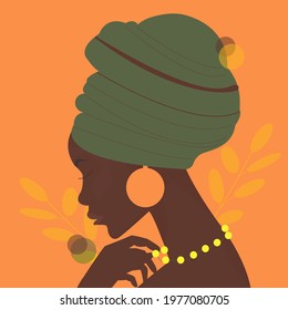 African woman Portrait of the young beautiful African woman in a turban African woman in a traditional headdress. Avatar of a girl with a scarf on her head for a social network. Portrait. Vector flat