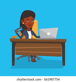African woman sitting at the table with laptop and holding credit card in hand. Woman using laptop for online shopping. Woman shopping online at home. Vector flat design illustration. Square layout.