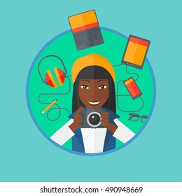 An african woman taking photo with digital camera. Woman surrounded with electronic gadgets. Woman using many electronic gadgets. Vector flat design illustration in the circle isolated on background.