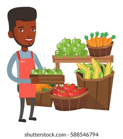 African worker of grocery store standing in front of section with vegetables and fruits. Worker of grocery store holding a box with apples. Vector flat design illustration isolated on white background