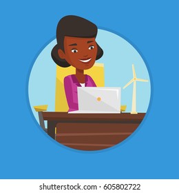 African worker of wind farm working on a laptop. Engineer projecting wind turbine. Smiling engineer with model of wind turbine. Vector flat design illustration in the circle isolated on background.
