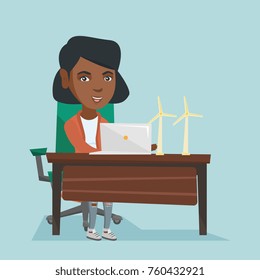 African worker of wind farm working on a laptop. Engineer projecting wind turbine in office. Worker of wind farm working with the model of wind turbine. Vector cartoon illustration. Square layout.