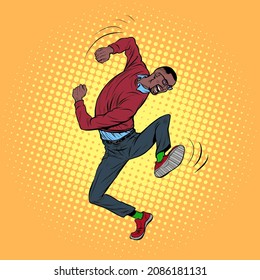 african young man dancing, stylish clothes. Freedom and fan, love of music