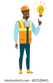 African-american builder in hard hat pointing at idea light bulb. Full length of builder having a creative idea. Successful idea concept. Vector flat design illustration isolated on white background.