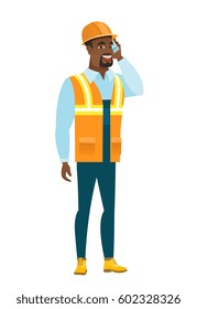 African-american builder in hard hat talking on a mobile phone. Young smiling builder talking on cell phone. Builder using cell phone. Vector flat design illustration isolated on white background.