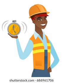 African-american builder showing ringing alarm clock. Young builder in hard hat with alarm clock. Happy builder holding alarm clock. Vector flat design illustration isolated on white background.