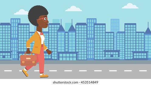An african-american business woman walking with a briefcase. Business woman walking down the street. Vector flat design illustration. Horizontal layout. An african-american business woman walking with a briefcase. Business woman walking down the street. Vector flat design illustration. Horizontal layout.