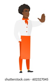 African-american chef cook showing stop hand gesture. Full length of chef cook doing stop gesture. Serious chef cook with a stop gesture. Vector flat design illustration isolated on white background.