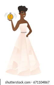 African-american fiancee in white dress showing a ringing alarm clock. Fiancee with alarm clock. Smiling fiancee holding an alarm clock. Vector flat design illustration isolated on white background.