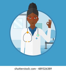 An african-american friendly doctor in medical gown showing ok sign. Smiling doctor gesturing ok sign in the hospital corridor. Vector flat design illustration in the circle isolated on background.