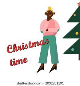 African-American girl with a Christmas tree and the inscription Christmas. New Year's theme. Winter time of the year.