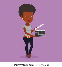 African-american happy woman working with a clapperboard. Smiling woman holding an open clapperboard. Cheerful woman holding blank movie clapperboard. Vector flat design illustration. Square layout.