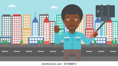 An african-american man making selfie with a selfie-stick. Man taking photo with cellphone and waving on a city background. Vector flat design illustration. Horizontal layout.