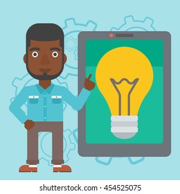 An african-american man pointing at a big tablet computer. Man standing near tablet computer with a light bulb on a screen. Vector flat design illustration. Square layout.