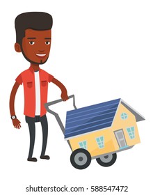 African-american man pushing a shopping trolley with a house. Young man buying home. Man using shopping trolley to transport a house. Vector flat design illustration isolated on white background.