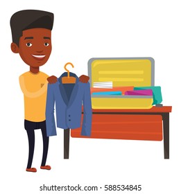 African-american man putting a jacket into a suitcase. Young man packing his clothes in an opened suitcase. Man preparing for vacation. Vector flat design illustration isolated on white background.