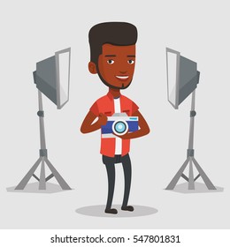 African-american photographer holding a camera in photo studio. Photographer using professional camera in the studio. Young photographer taking a photo. Vector flat design illustration. Square layout.
