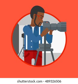 An african-american photographer working with camera on a tripod in photo studio. Photographer using camera in the studio. Vector flat design illustration in the circle isolated on background.