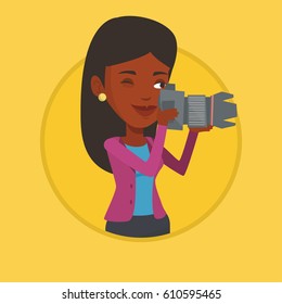 African-american photographer working with digital camera. Photographer taking a photo. Smiling photographer taking a picture. Vector flat design illustration in the circle isolated on background.