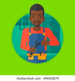 An african-american repairman with a spanner in hand. A repairman giving thumb up. A repairman at domestic household boiler room. Vector flat design illustration in the circle isolated on background.
