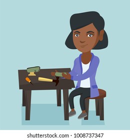 African-american shoemaker repairing a shoe in the workshop. Young shoemaker making handmade shoes in the workshop. Shoemaker working in the workshop. Vector cartoon illustration. Square layout.