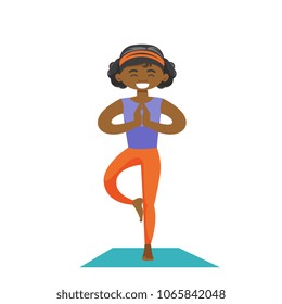 African-american sportswoman meditating in yoga tree position. Young happy sporty woman standing in yoga tree pose on the mat. Vector cartoon illustration isolated on white background. Square layout.